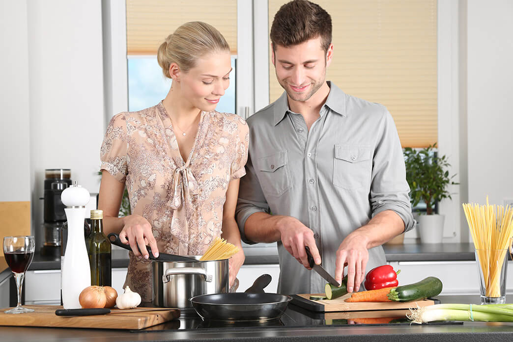 Residents at Woodhaven Old Bridge, NJ cooking in their new construction townhome 